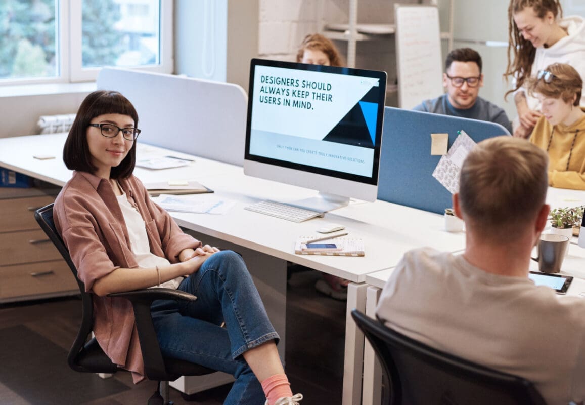 Business woman discussing website design with team and focusing on users